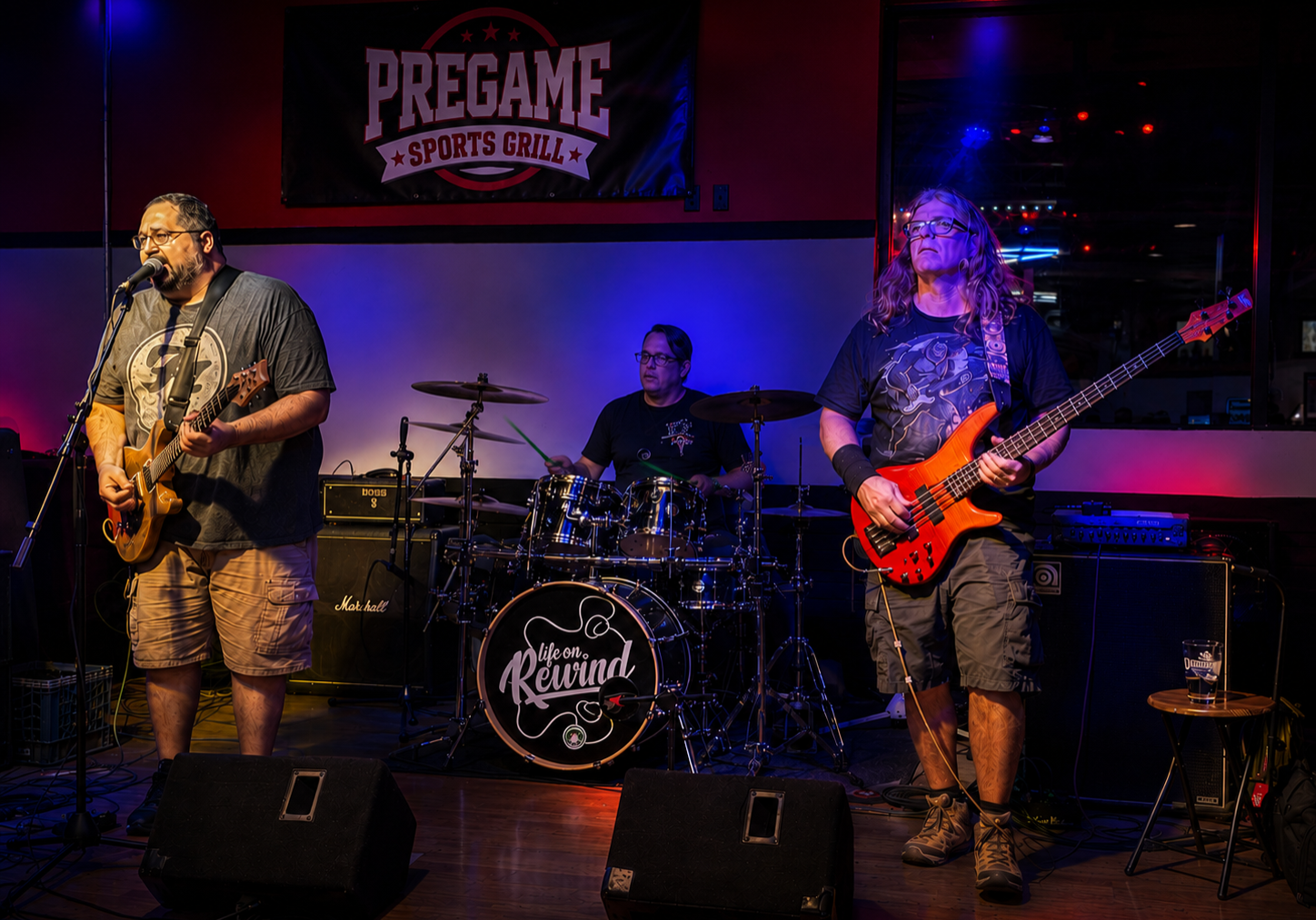 Three person band playing for the friends and family soft opening
